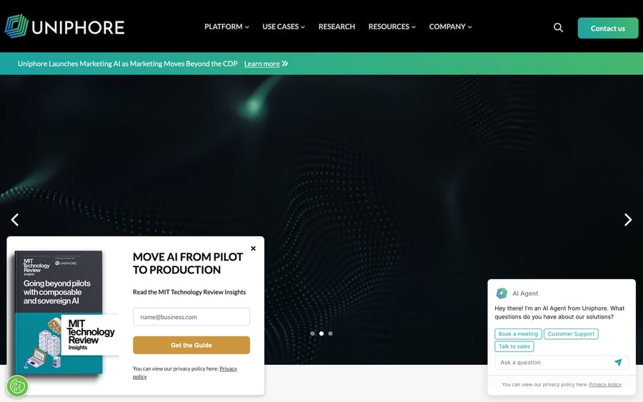 Uniphore's homepage, with its embedded AI Agent chat widget offering to book a meeting or talk to sales.