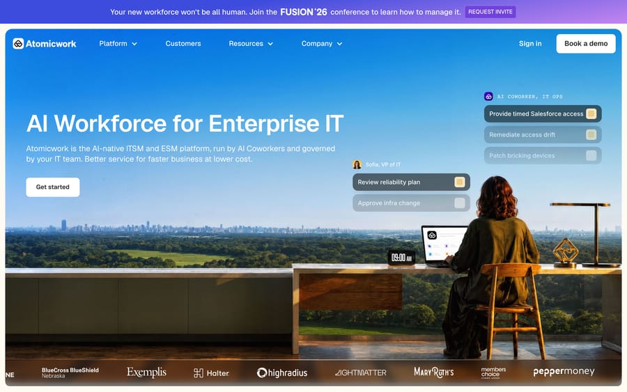 Atomicwork homepage showing an AI Coworker assisting a VP of IT with access requests and infrastructure approvals.