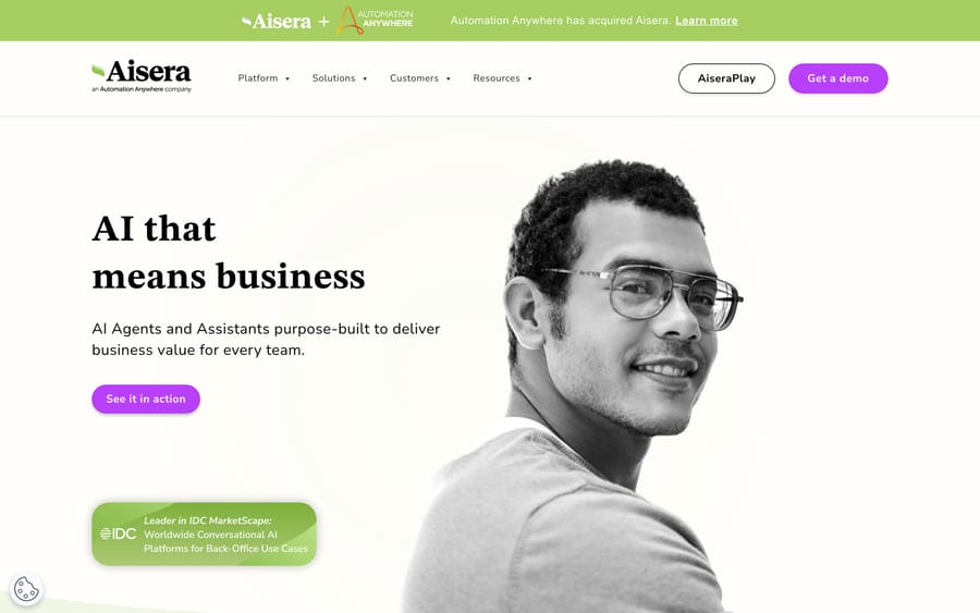 Aisera's homepage banner confirming Automation Anywhere's acquisition, above its "AI that means business" headline.