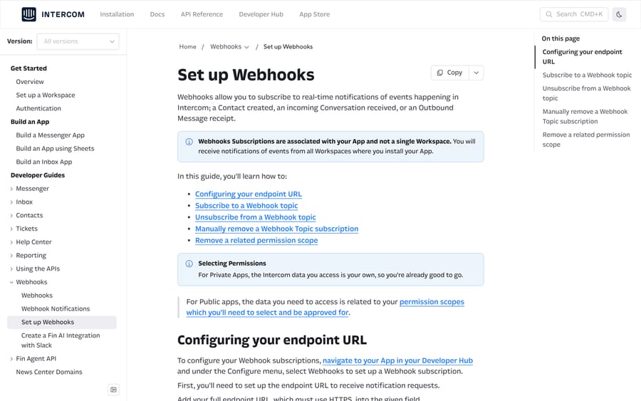 Intercom's Set up Webhooks guide, noting that subscriptions belong to the app and not one workspace