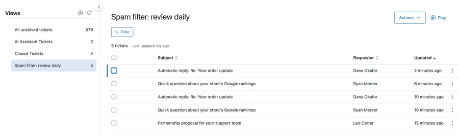 The Spam filter: review daily view in d3v-macha, listing five filtered test tickets with subject and requester